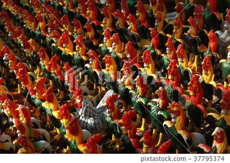 pile of ceramic rooster figure sculpture 37795374