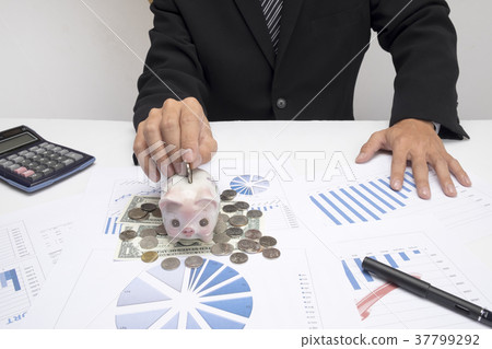 Business man hand putting mix coins. 37799292