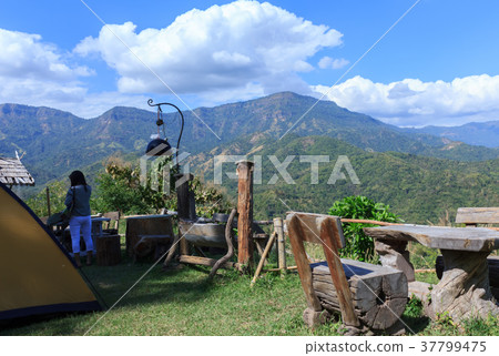 Wooden chairs for a scenic ride on the mountain. 37799475