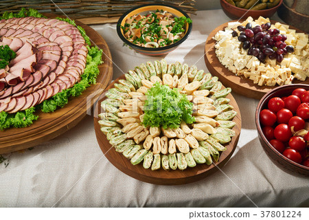 Restaurant table full of meat and vegetable Restaurant table full of meat and vegetable 37801224