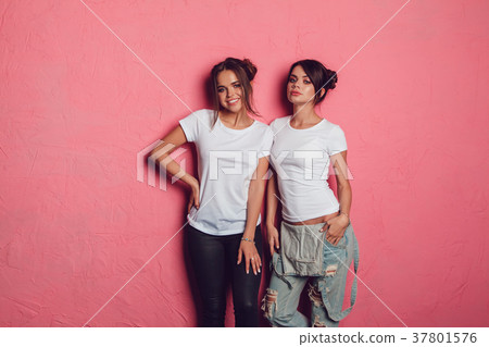 Attractive women in a white t-shirts stands on a 37801576