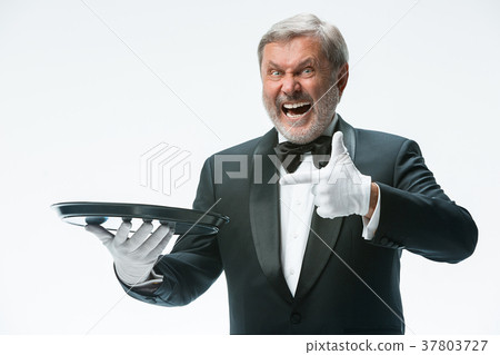 Senior waiter holding tray 37803727