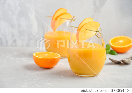 Healthy smoothie with persimmon, orange and ginger 37805490