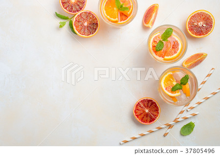 Cold refreshing drink with blood orange slices. 37805496