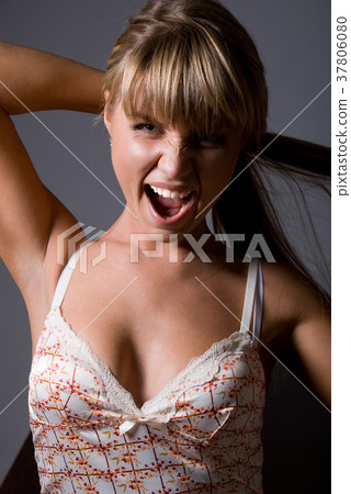Emotional young woman screaming. 37806080