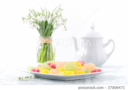 spring snowdrops and dessert fruit candy with 37806471