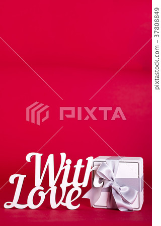 Gift box with silver ribbon bow Gift box with silver ribbon bow 37808849