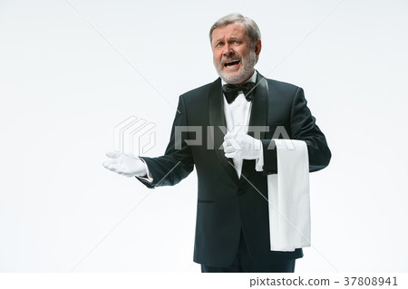 Senior waiter holding white towel 37808941