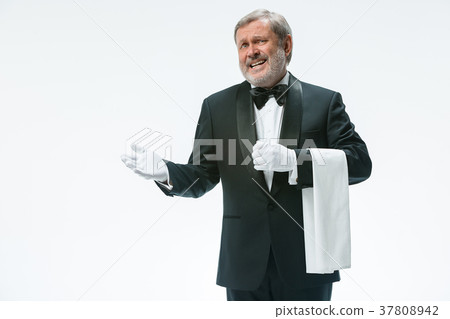 Senior waiter holding white towel 37808942