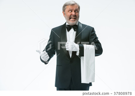 Senior waiter holding white towel 37808978