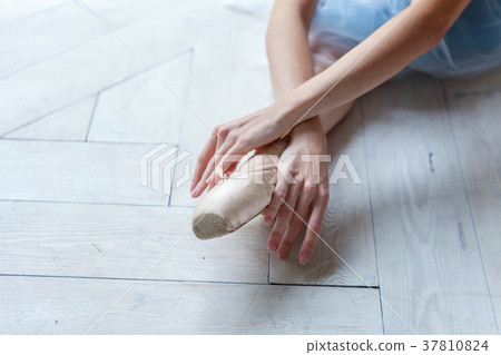 young ballet-dancer sitting on the floor young ballet-dancer sitting on the floor 37810824