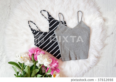 Black and gray tops, peonies on white fur 37812698