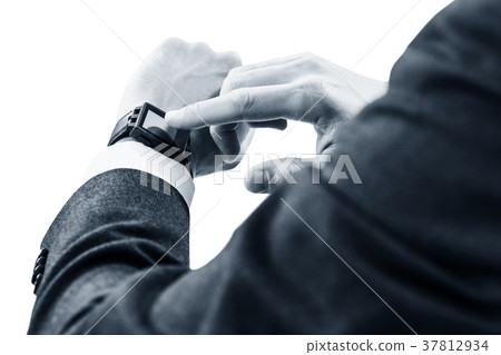 Closeup hands of man using his smartwatch. Closeup hands of man using his smartwatch. 37812934