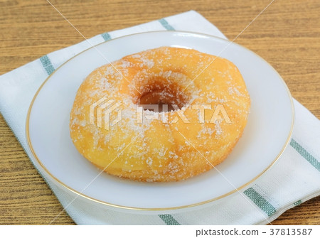 Glazed Donut with Sugar on White Dish 37813587