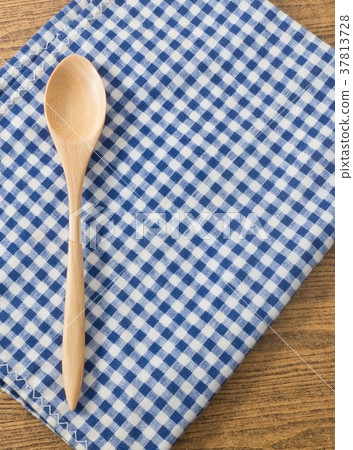 Wooden Spoon on Blue and White Checked Napkin Wooden Spoon on Blue and White Checked Napkin 37813728
