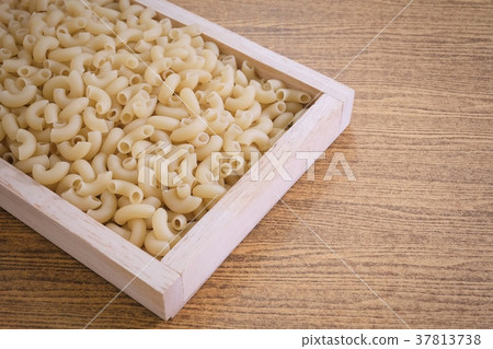 Elbow Macaroni or Gomiti Pasta in Wooden Tray 37813738