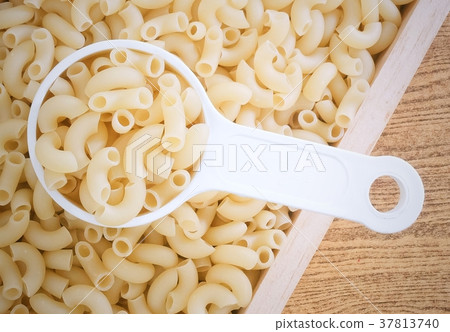 Top View of Elbow Macaroni in Measuring Cup 37813740