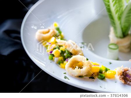 Calamari with mango sauce. 37814306