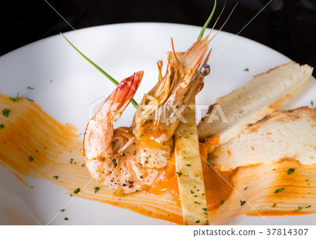 Tiger prawn with spicy sauce with nice decoration. 37814307