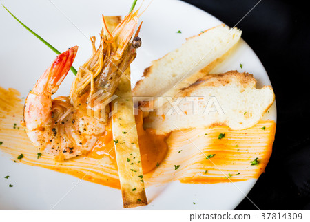 Tiger prawn with spicy sauce with nice decoration. 37814309
