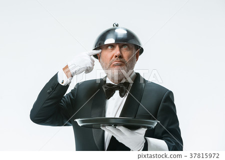 The waiter with tray and metal cloche lid cover 37815972