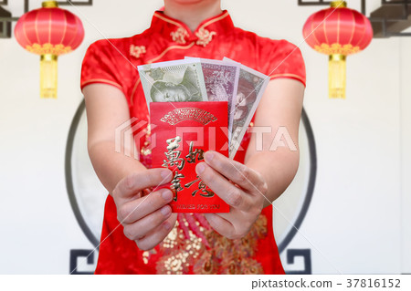 woman holding new year red envelope or hong bao woman holding new year red envelope or hong bao 37816152