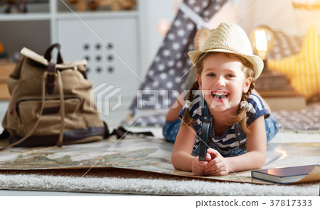 funny child girl tourist with world map, backpack and magnifier 37817333