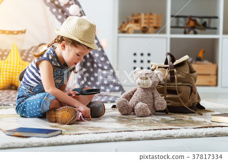 funny child girl tourist with world map, backpack and magnifier 37817334