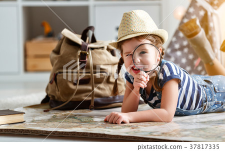 funny child girl tourist with world map, backpack and magnifier 37817335
