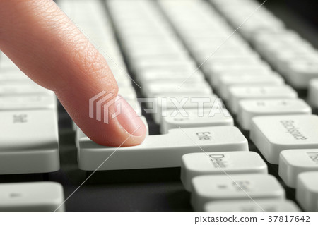 Finger pushing enter button Finger pushing enter button 37817642