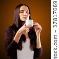 Coffee. Beautiful Girl Drinking Tea or Coffee. 37817669