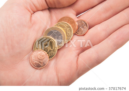 handful of euro coins in hand handful of euro coins in hand 37817674
