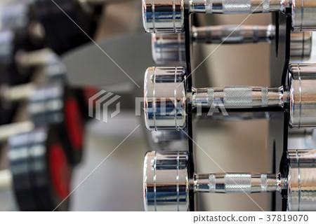 Closeup image of chrome dumbbells 37819070