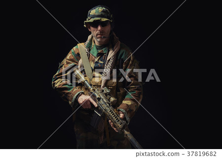 soldier of the American special forces in Afghanistan poses with a rifle 37819682
