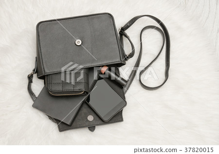 Open black bag with dropped things, notebook 37820015