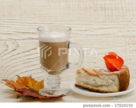 Apple pie and cappuccino on a wooden background Apple pie and cappuccino on a wooden background 37820150