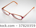 Eyeglasses on white background with soft focus 37820359