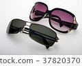 Two sunglasseses on white background 37820370