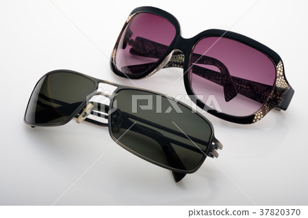 Two sunglasseses on white background Two sunglasseses on white background 37820370