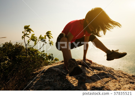 female practicing yoga arm-balance handstand Crane 37835521