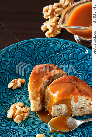 Piece Banana cake with walnut and caramel topping. Piece Banana cake with walnut and caramel topping. 37839449