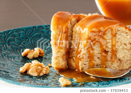 Piece of Banana cake with walnut and caramel fudge Piece of Banana cake with walnut and caramel fudge 37839453