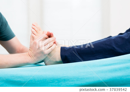 Patient having foot massage at physio Patient having foot massage at physio 37839542