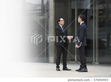 Businessman making handshake agreement. Businessman making handshake agreement. 37840403