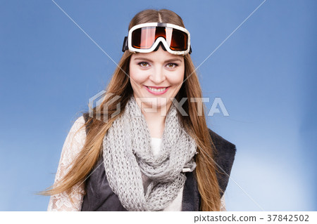 skier girl wearing warm clothes ski googles portrait. skier girl wearing warm clothes ski googles portrait. 37842502