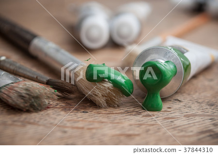 green acrylic paint on wooden table background 37844310