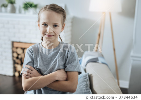 Content girl standing with her hands crossed 37844634