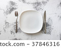White Plate on white wooden background  37846316