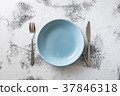 Blue Plate on white wooden background  37846318