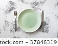 Green Plate on white wooden background  37846319
